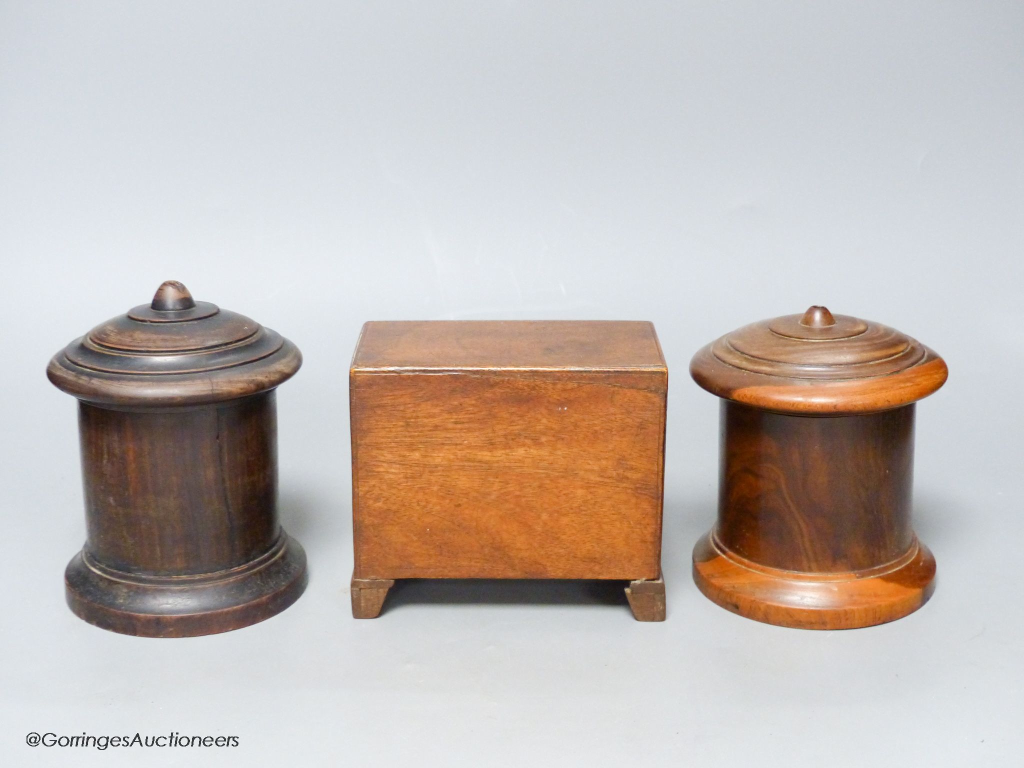 Two 19th-century Lignum vitae string boxes and a Georgian style walnut miniature chest of drawers, height 11.5cm width 13cm